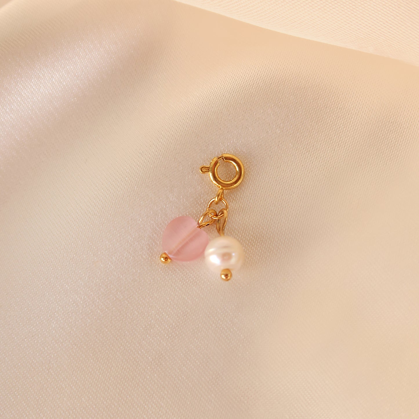 Pearl and pink heart cat's eye pendant